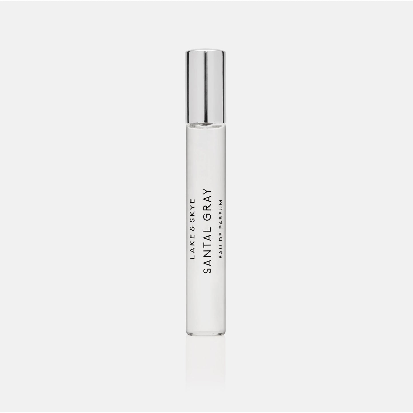 A cylindrical bottle of 'santal 33' perfume by le labo against a white background.