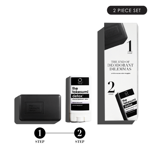Two-piece takesumi detox deodorant set with a bar of soap and stick deodorant against a black background.