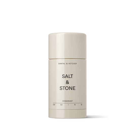 A stick of salt & stone deodorant against a neutral background.