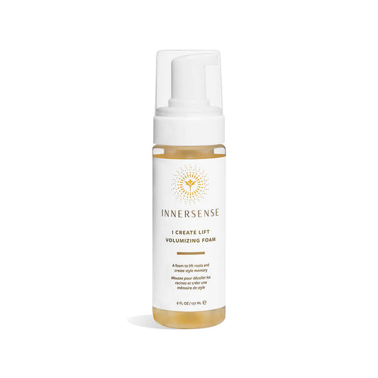Bottle of innersense organic beauty - i create lift volumizing foam against a white background.