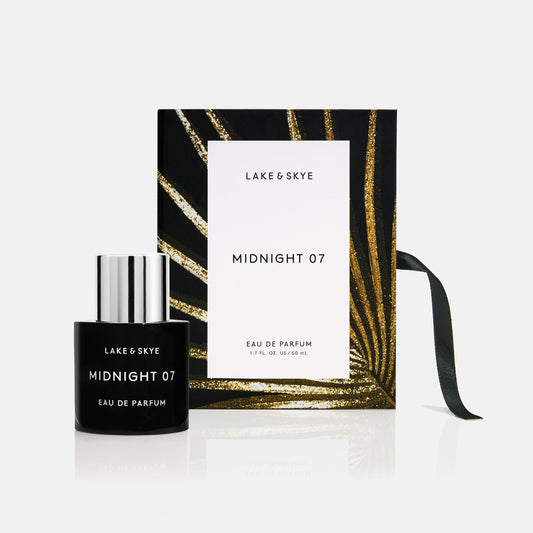 A bottle of 'lake & skye midnight 07' eau de parfum presented next to its packaging.