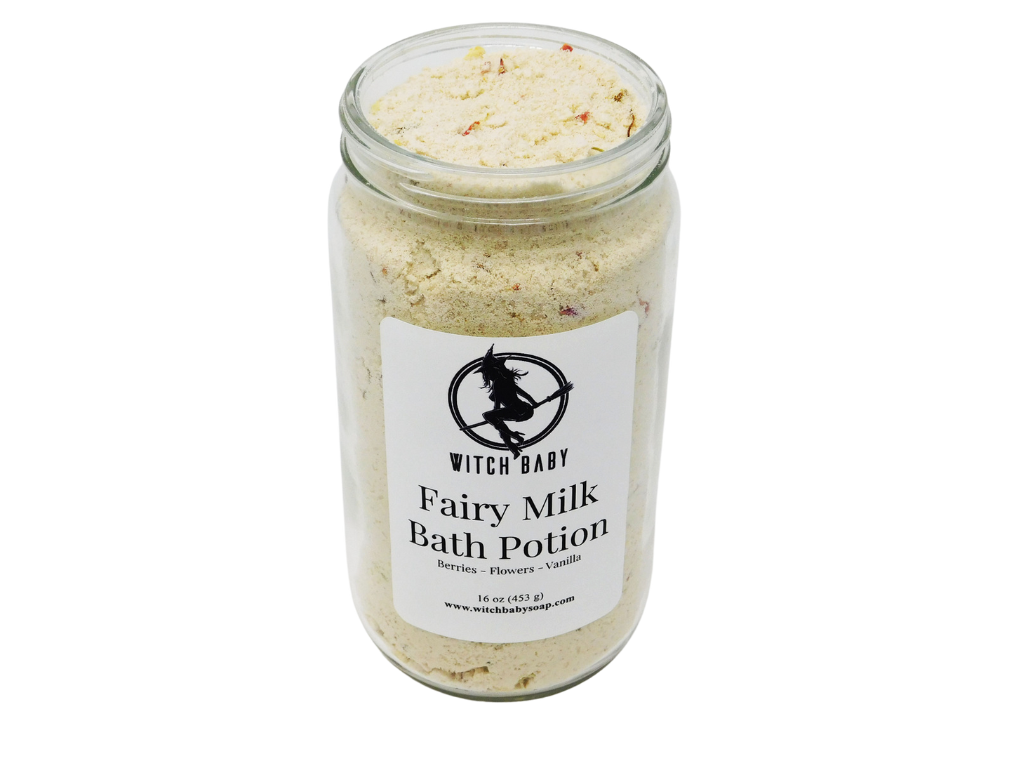 white powdery bath potion full of flowers and salt in a 16 oz glass jar with a label that reads: Fairy Milk Bath Potion. Berries - Flowers - Vanilla..