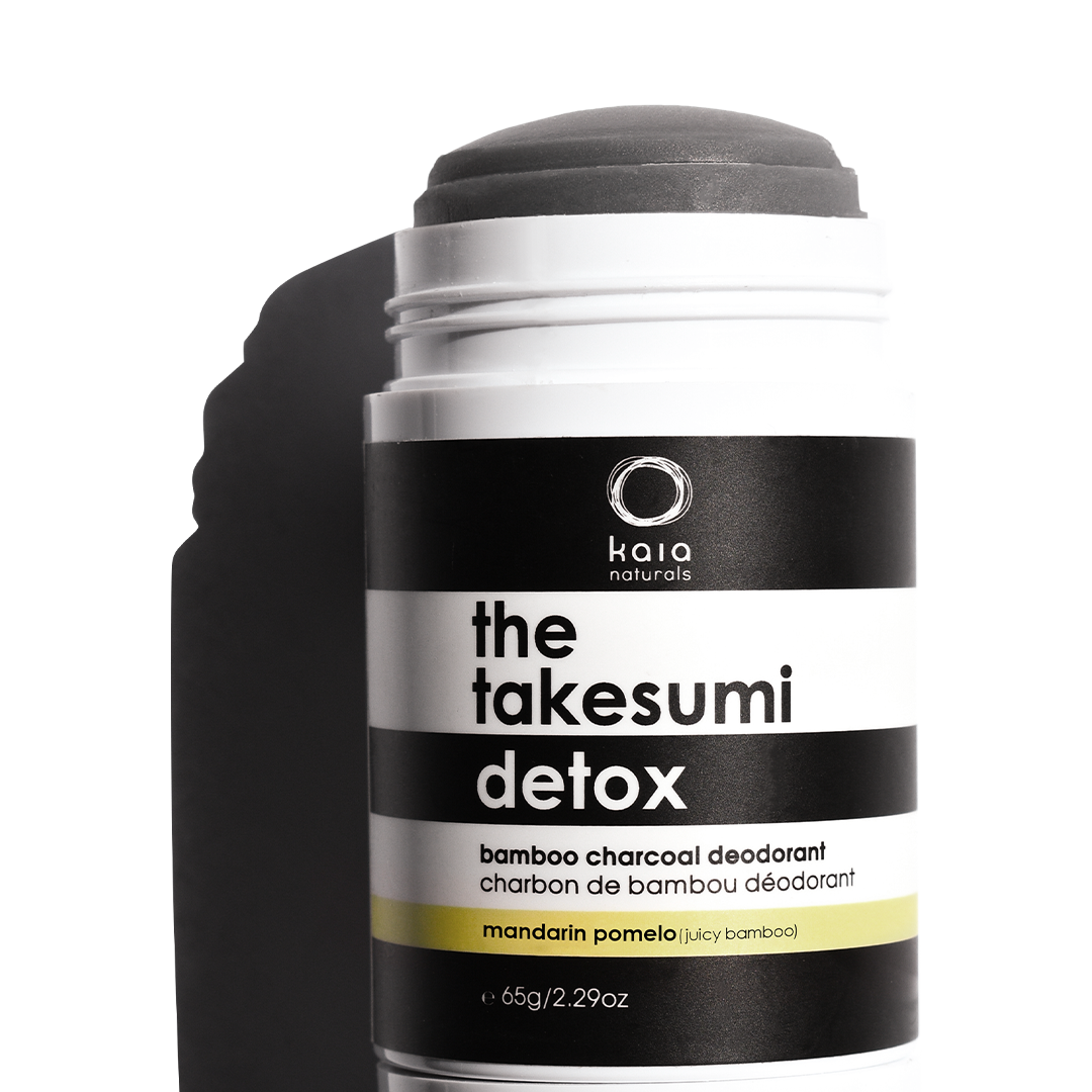 Container of "kaia naturals - the takesumi detox" bamboo charcoal deodorant with mandarin pomelo scent.